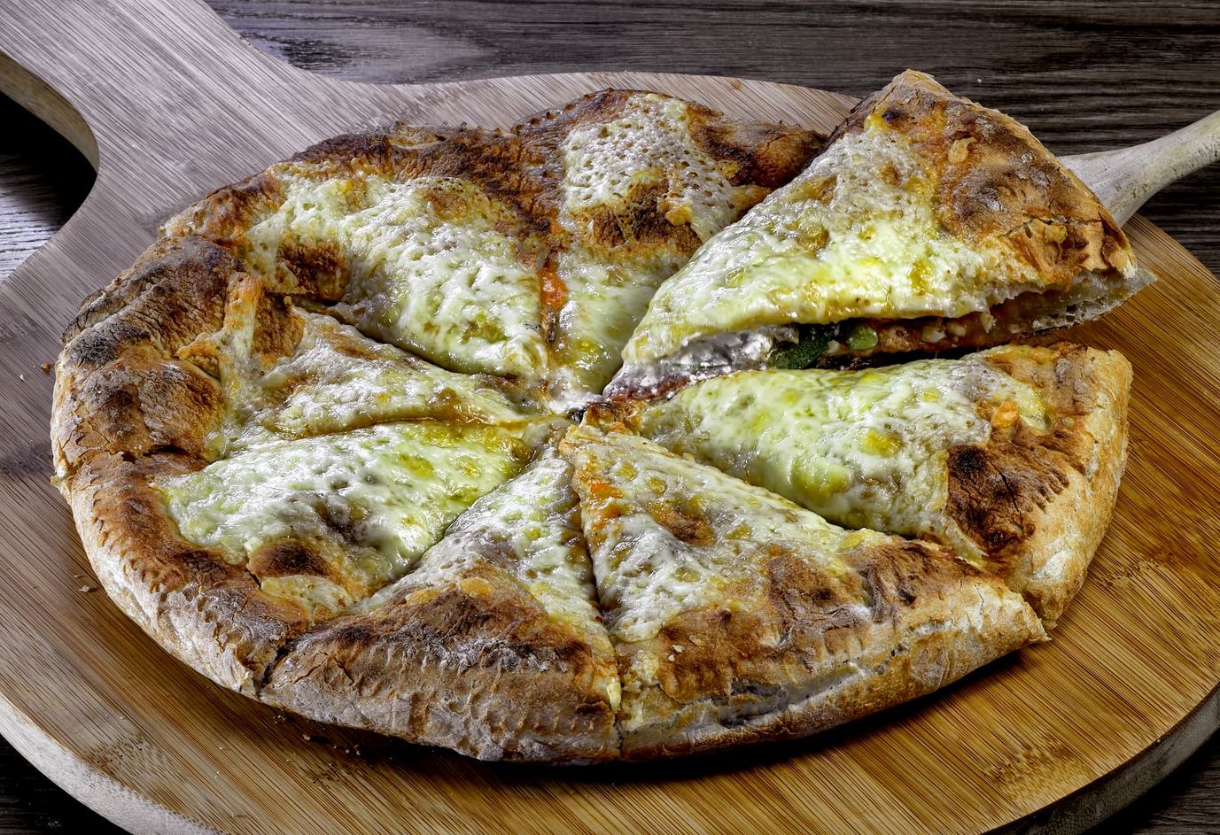 A Chicago deep dish pizza, cut in half