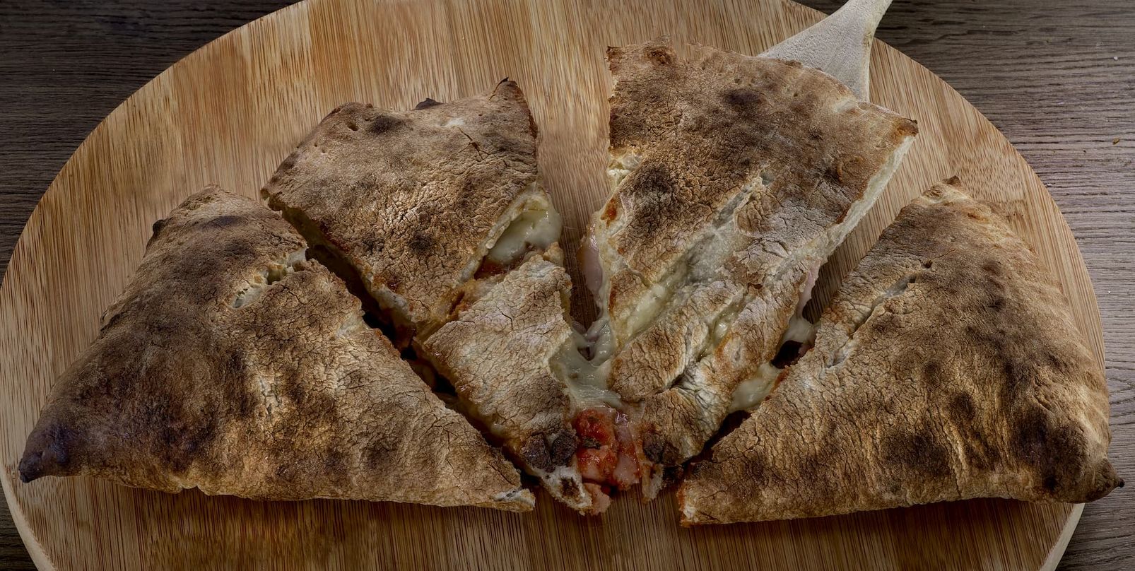 A village calzone, baked and sliced